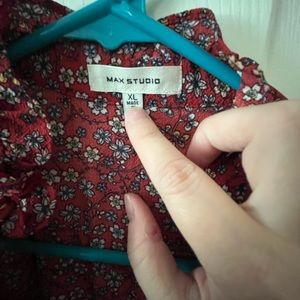 Floor length dress with ruffle collar.